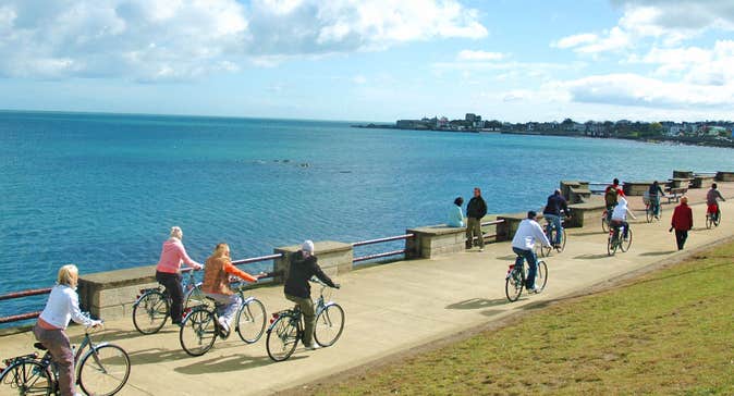 Irish Cycling Safaris cyclists on a path along the coast of Dublin Bay