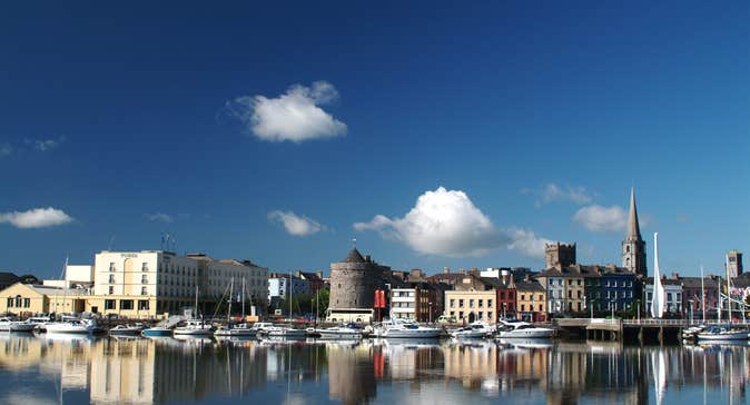 View Of Waterford Quay in Waterford City on a sunny day with buildings in the background.