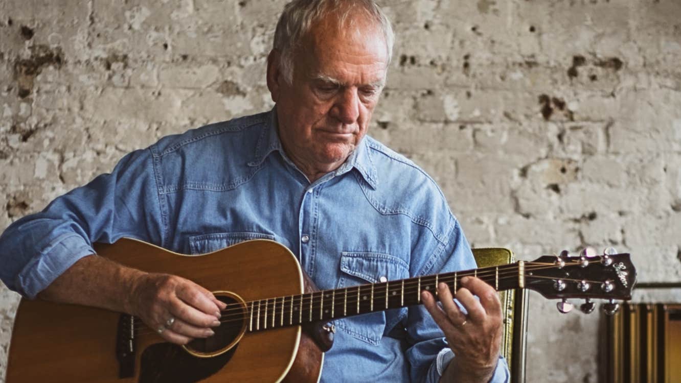 Ralph McTell playing guitar