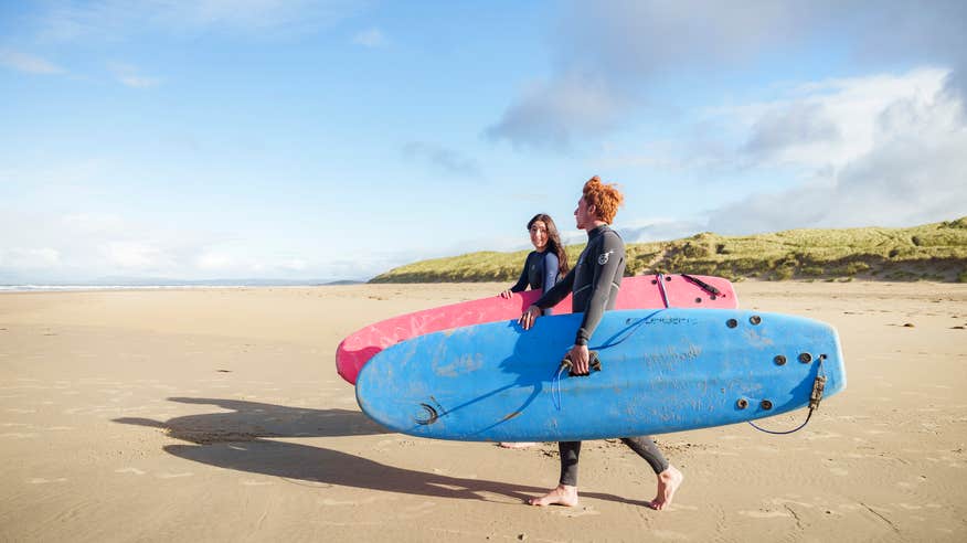 Two surfers on Tullan Strand in Co Donegal