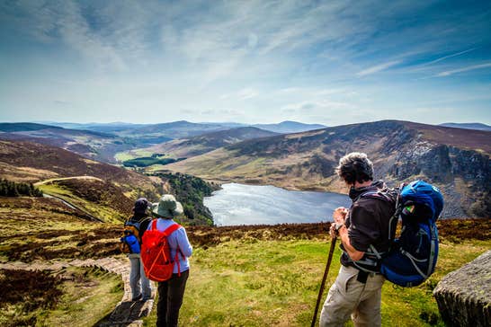 Hikers enjoying a view of Lough Tay from above