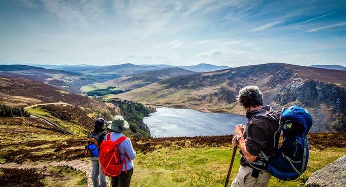 Hikers enjoying a view of Lough Tay from above
