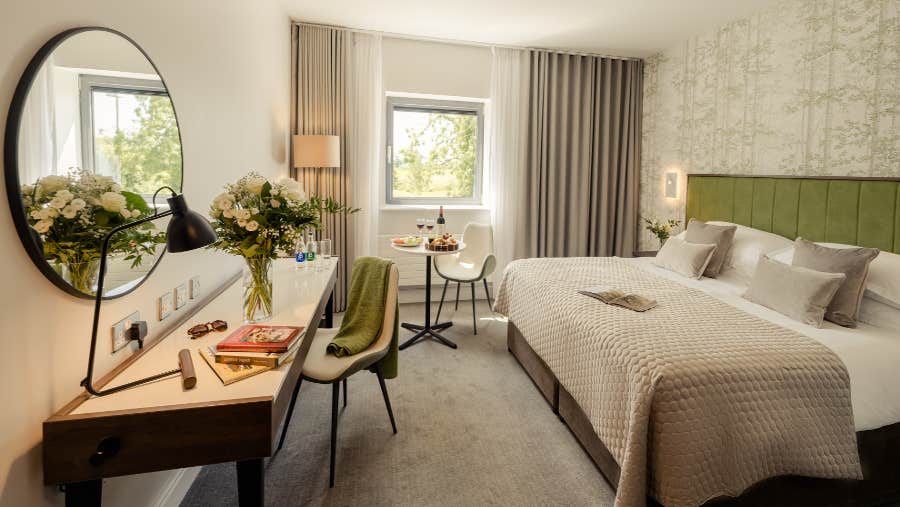 King size bedroom with green headboard
