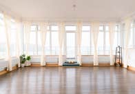 An image of one of Kindred Studios for ballet with open drape curtains allowing natural light in