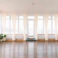 An image of one of Kindred Studios for ballet with open drape curtains allowing natural light in