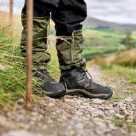 Hiking boots and a stick