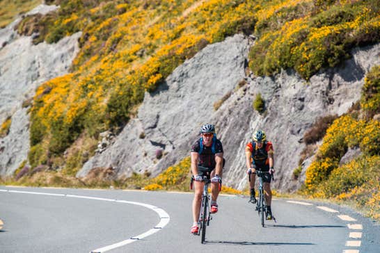 Two cyclists cycling the Ring of Kerry, County Kerry