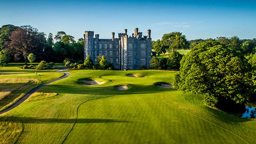 A castle overlooking a golf course