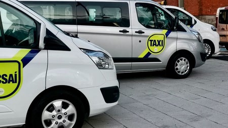Several vans parked in a row