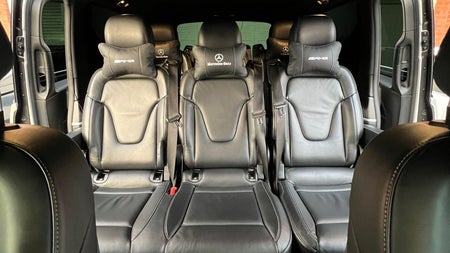 Looking at three seats in the back of a bus