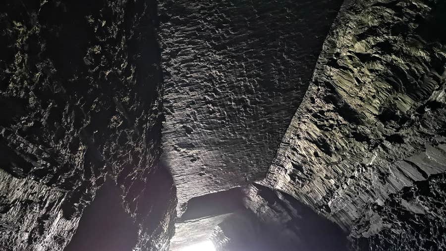 Interior of cave at Valentia Slate with a chink of light
