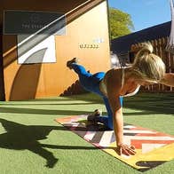A person performing fitness exercises on a mat