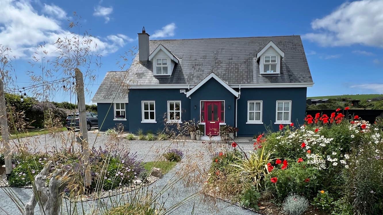 House set on a flower garden.