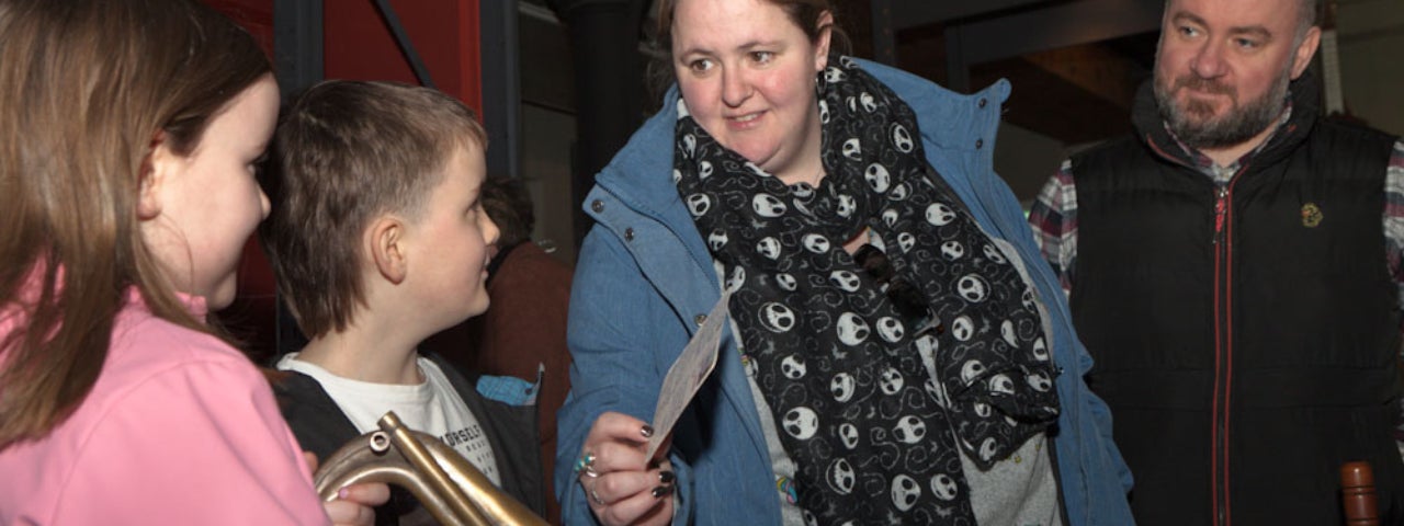 Image of a family engaging with Handling Objects