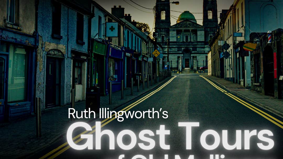 Ghost Tours of Old Mullingar - a view of an empty street at dusk with a church in the distance at the end of the road.