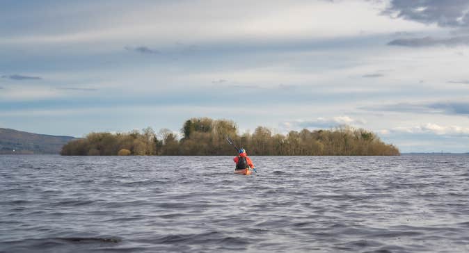 A man kayaking in the River Shannon