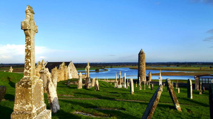 Towers and old buildings in a field at Clonmacnoise in Offaly