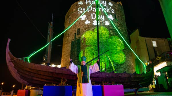 Saint Patrick in front of Reginalds Tower in Waterford City