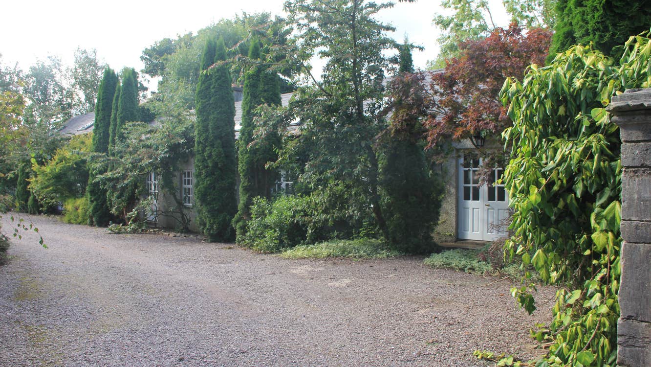 Apartments set in mature landscape.
