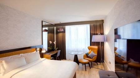 Double bed with white sheets