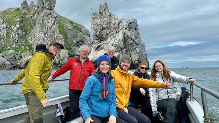 A group of passengers on a tour boat at sea