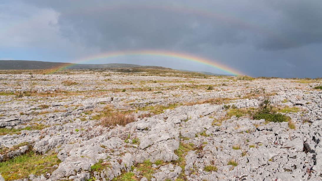 A double rainbow over the rocky landscape of The Burren, County Clare