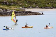Three kayakers and 1 windsurfer in Derrynane