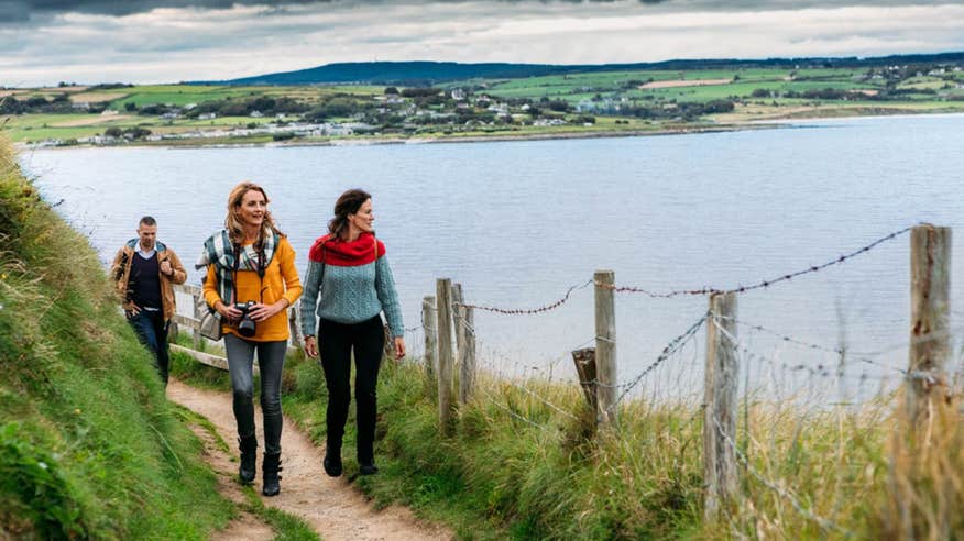 People walking along the Ardmore Cliff Walk County Waterford