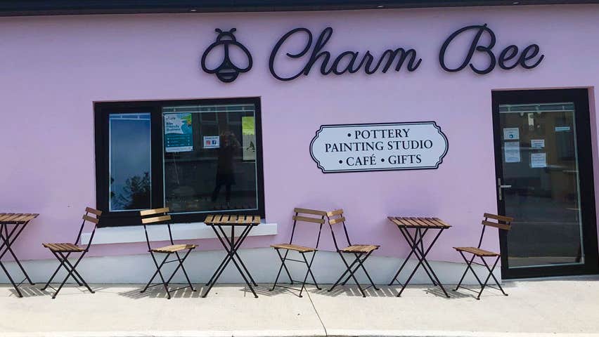 Exterior view of Charm Bee with café table and chairs outside