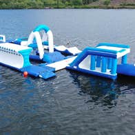An inflatable obstacle course floating on water