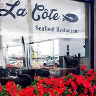 Restaurant window with red flowers