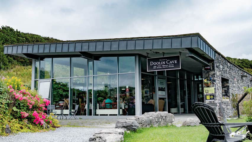 A view of the Doolin Cave Visitor Centre from their garden with colourful flowers