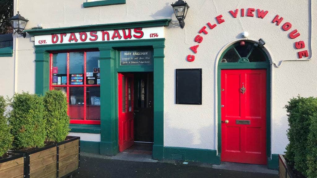 Red front door of Bradshaws Pub