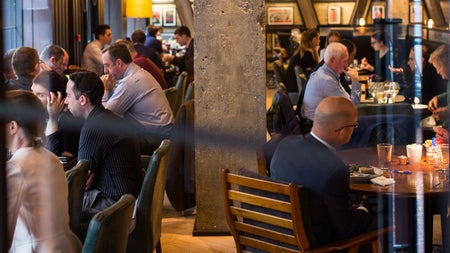 People enjoying food and drinks in the bar