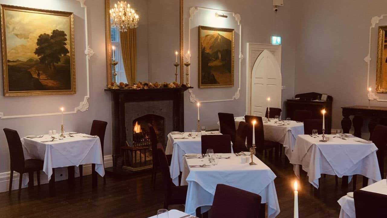 An empty dining area with prepared tables ready for diners