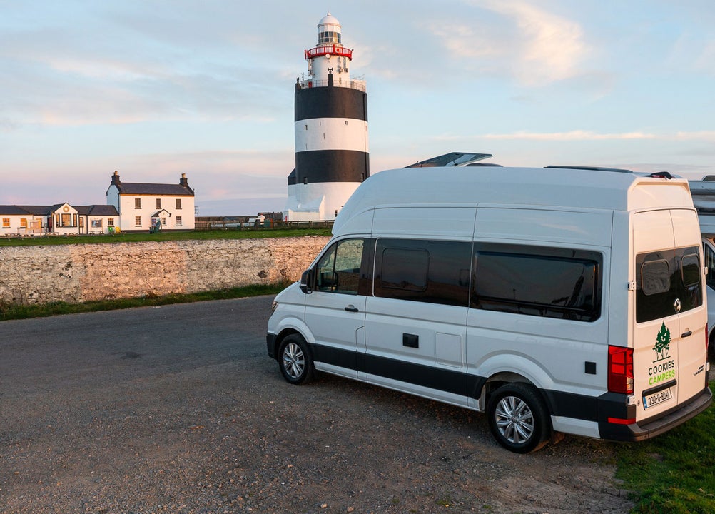 Cookies Camper parked by a lighthouse