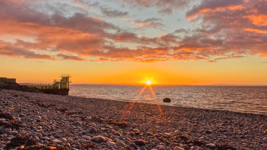 Sunset at a stony beach in Salthill, Galway