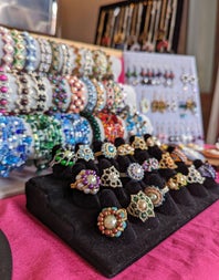 A selection of colourful jewellery for sale in a market stall