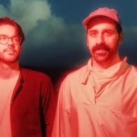 2 men side by side with orange tinted photo