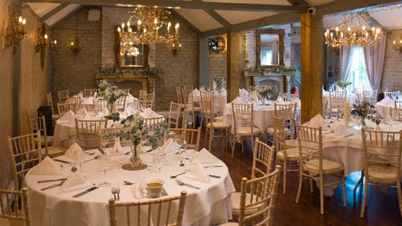A reception room dressed for a wedding dinner at Wright's Anglers Rest