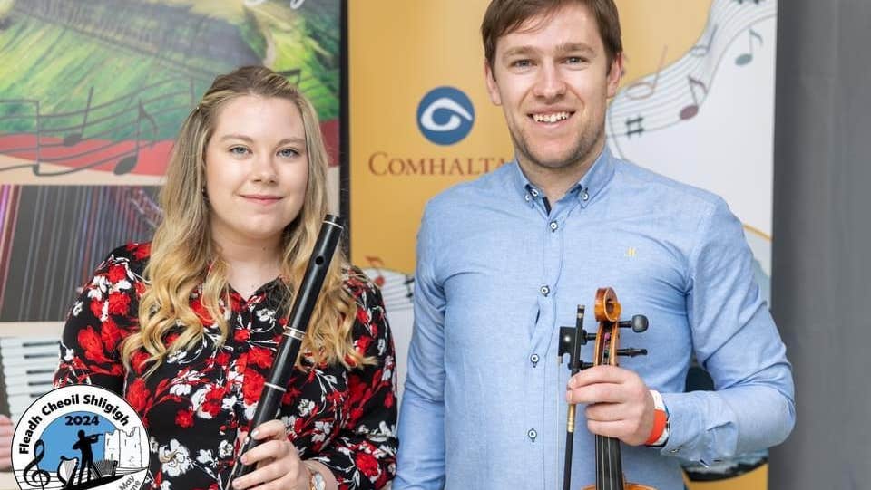 Jason and Lorna McGuinness with musical instruments