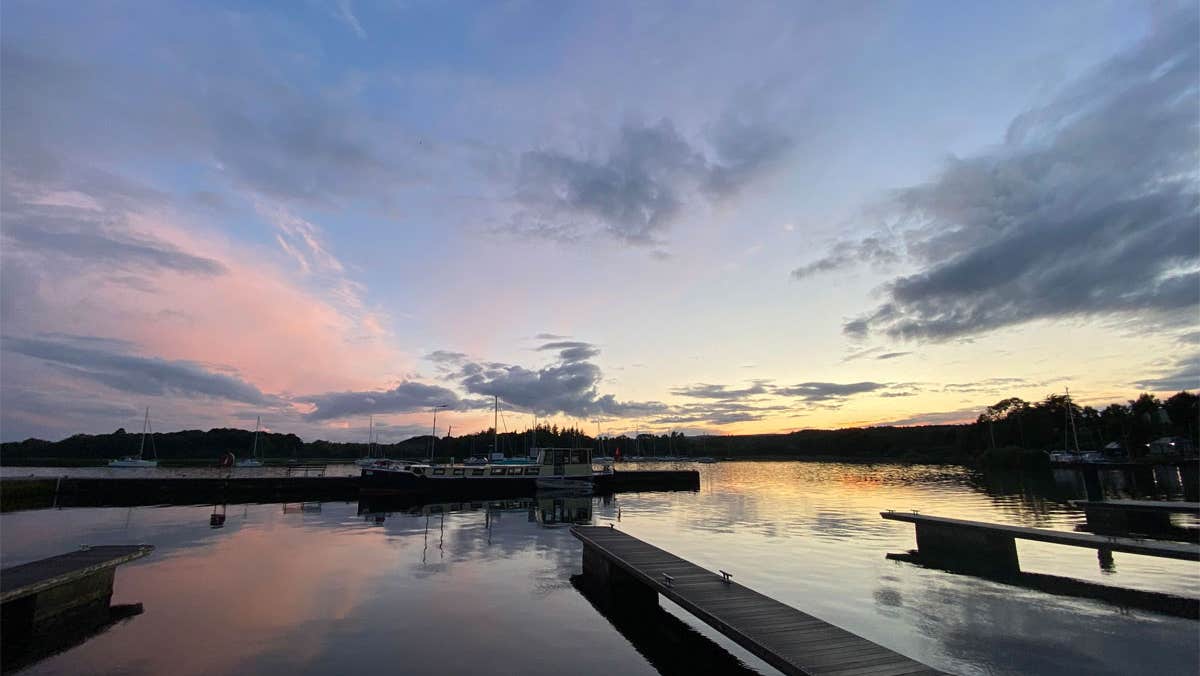 View over the pontoon and boats at sunset