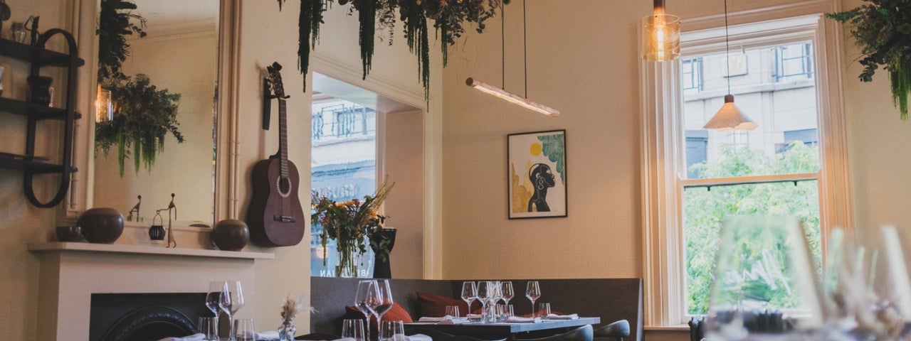 Seating and tables set for dining at Amai By Viktor
