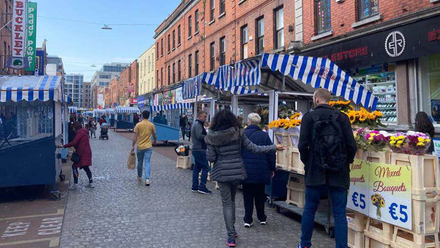 People walking around Moore Street Market in Dublin City centre