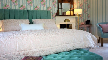 Bedroom view with side table and lamp