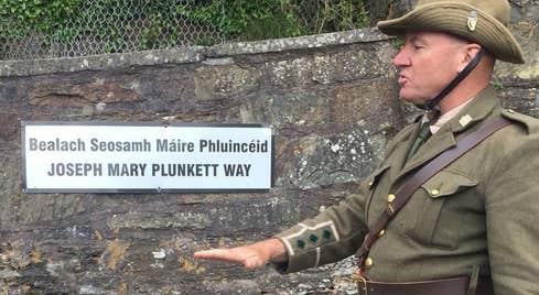 Cobh Rebel Walking Tours guide in rebel uniform at one of the tour stops