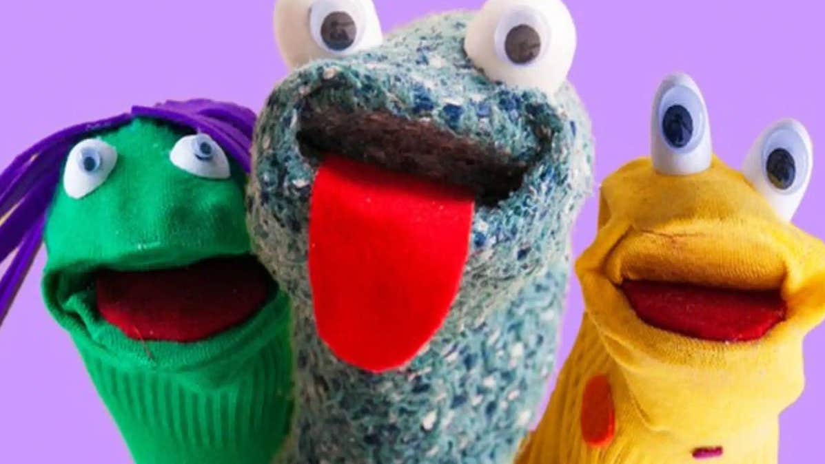 Three different coloured sock with eyes/tongues and eyes on to make puppets