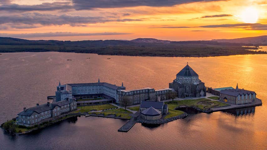 A beautiful view of St Patricks Purgatory on Station Island in Lough Derg at sunset