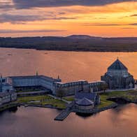A beautiful view of St Patricks Purgatory on Station Island in Lough Derg at sunset