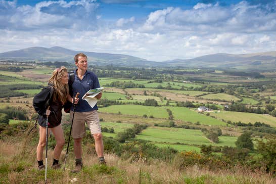 Two people reading a map and walking The Wicklow Way, Wicklow